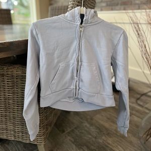 Brandy Melville light blue becca cropped zip up hoodie.